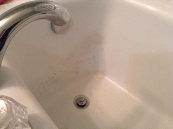 black specks in water from kitchen sink