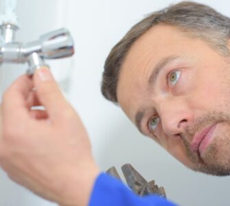 inspecting shower leak